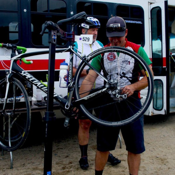 a bicycle parked in front of a bus