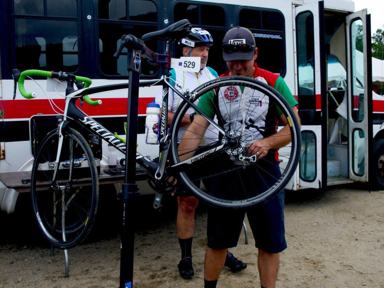 a bicycle parked in front of a bus