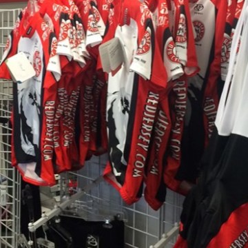 a group of men in red shirts
